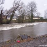 Photo of the Kings River in County Kilkenny Ireland. Pictures of Irish whitewater kayaking and canoeing. This is the first weir at the get on with almost highish water. Photo by Adrian S