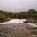 Photo of the Adrigole river in County Cork Ireland. Pictures of Irish whitewater kayaking and canoeing. slide under bridge
mw sept 1998. Photo by dave g