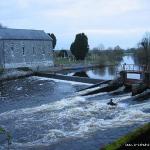 Photo of the Suck river in County Roscommon Ireland. Pictures of Irish whitewater kayaking and canoeing. Mark Burns surfing in Athleague . Photo by Mark Burns