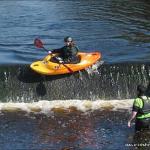 Photo of the Suck river in County Roscommon Ireland. Pictures of Irish whitewater kayaking and canoeing. Catherine Burns on a personal first descent of Athleague Weir!. Photo by Mark Burns