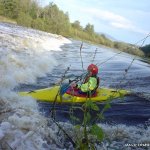 Photo of the Barrow river in County Carlow Ireland. Pictures of Irish whitewater kayaking and canoeing. clare mcsweeney running the second wier at clashganny high water. Photo by michael flynn