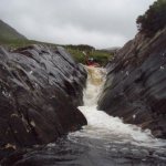 Photo of the Glenacally river in County Mayo Ireland. Pictures of Irish whitewater kayaking and canoeing. Alan running the final drop.Tight like tiger. Photo by Seymour Butts