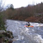 Photo of the Nire river in County Waterford Ireland. Pictures of Irish whitewater kayaking and canoeing. kev heads off downstream of the get on . Photo by Michael Flynn