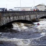 Photo of the Lower Corrib river in County Galway Ireland. Pictures of Irish whitewater kayaking and canoeing. Eadoin surfing her slalom boat.. Photo by Eoin Hurst