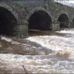 Photo of the Aughrim river in County Wicklow Ireland. Pictures of Irish whitewater kayaking and canoeing. aughrim bridge savage high water, tullow k/c. Photo by steve