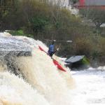 Photo of the Ennistymon Falls in County Clare Ireland. Pictures of Irish whitewater kayaking and canoeing. Brian Duggan, showing off!. Photo by Tiernan