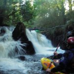 Photo of the Clare Glens - Clare river in County Limerick Ireland. Pictures of Irish whitewater kayaking and canoeing. Ryan Venkins watches noel brown hittin sidewinder. Photo by steve fahy