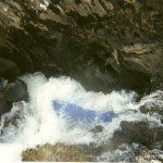 Photo of the Gearhameen river in County Kerry Ireland. Pictures of Irish whitewater kayaking and canoeing. My Old Acro pinned in the slot drop, feb 2000. Photo by J Keasley